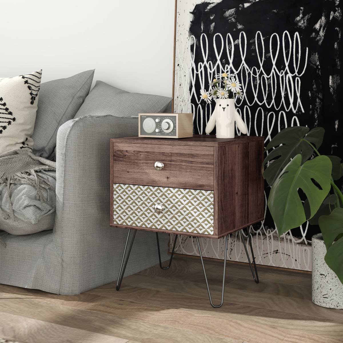 Wooden side table with patterned drawers next to a gray sofa in a living room.