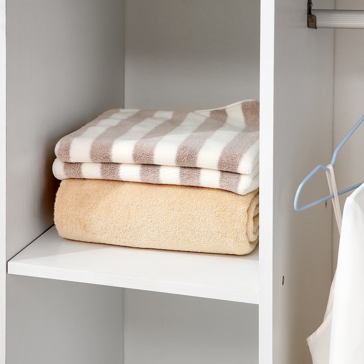 Versatile White Storage Wardrobe with Shelves & Wheels for Easy Organization